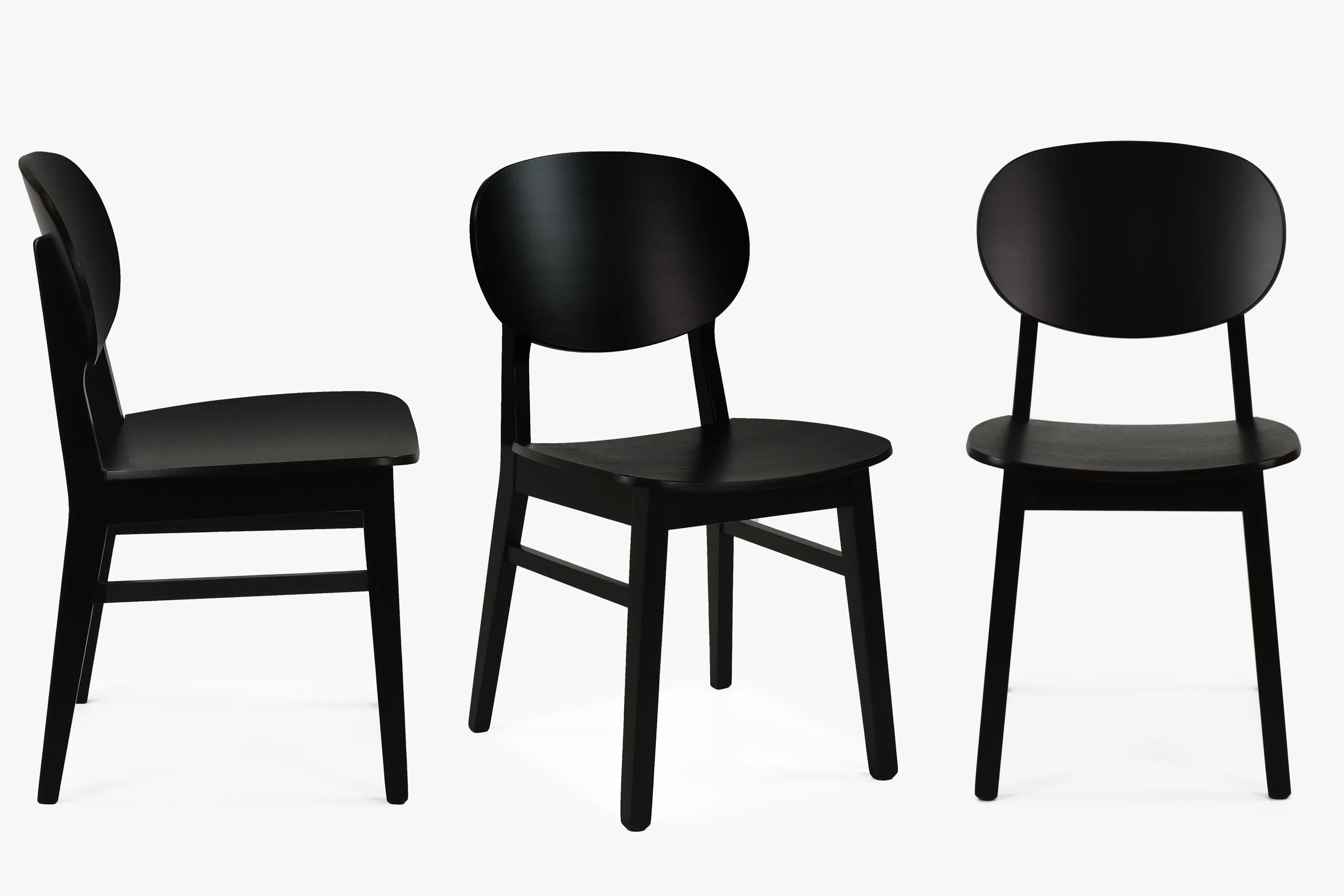 Stolička do jedálne, čierna - masívne drevo, dizajnový tvar 